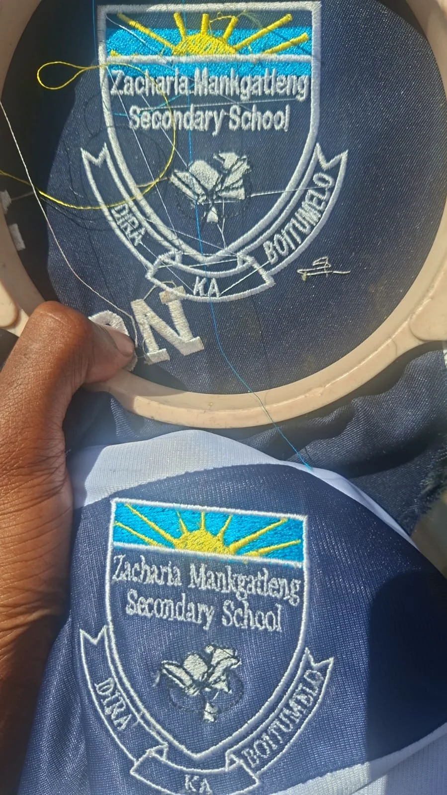 Blue polo shirts with embroidered community-policing logos.