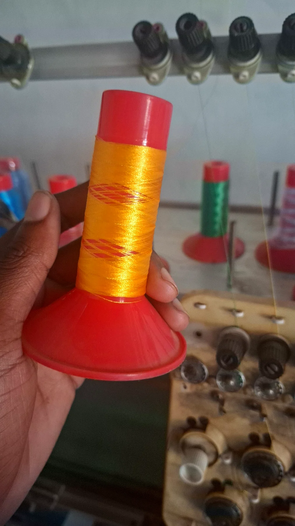 Gold embroidery thread prepared for machine stitching.